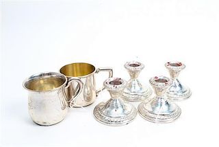 * Four American Silver Candlesticks Height of tallest 2 1/2 inches.