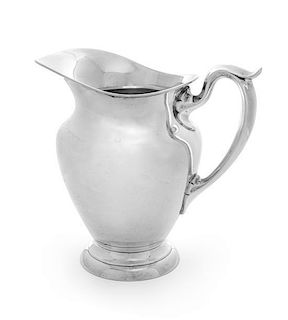 An American Silver Pitcher, Gorham Mfg. Co., Providence, RI, 1973, of baluster form with a C-scroll handle.