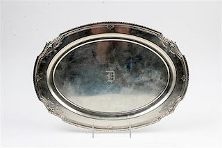 An American Silver Serving Dish, R. Wallace & Sons, Wallingford, CT, the oval form platter worked with volute and bell flower