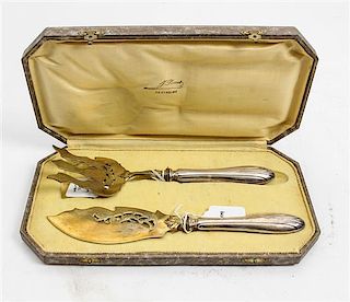 * A French Silver and Gilt-Metal Fish Serving Set, , comprising a fish slice and serving fork, each with a foliate decorated