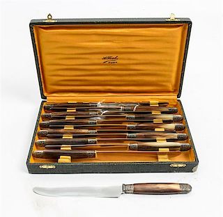 * A Set of Twelve French Horn-Handled Dinner Knives Length 9 1/2 inches.