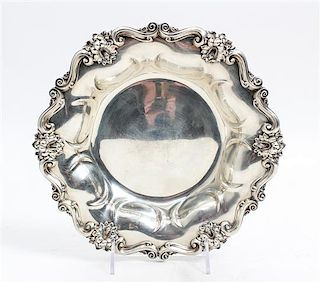 * An American Silver Bowl, Meriden Britannia Co., Meriden, CT, having an S-scroll and floral spray decorated rim with a lobed