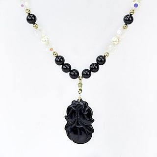 Black Onyx, Carved Crystal, Pearl and 14 Karat Yellow Gold Pendant Necklace.