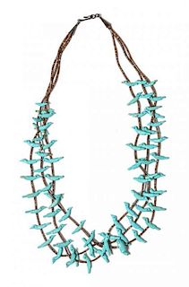 A Santo Domingo Turquoise and Heishi Three Strand Fetish Necklace Length 44 inches