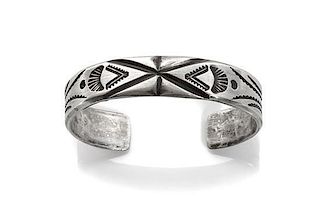A Navajo Silver Tooled Cuff, Mark Chee (1914-1981) Length 5 3/8 x opening 7/8 x width 3/8 inches.