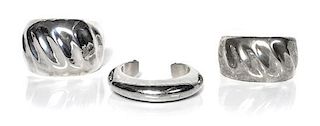 Three Navajo Holloware Silver Cuffs, Orville Tsinnie (1943-2017) Length of one 5 1/2 x opening 7/8 x width 1 7/8 inches.