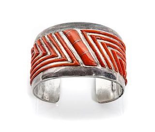 A Navajo Silver, Brass and Coral Cuff, Rita and Jimmy King Length 6 1/2 plus 1 x width 1 1/3 inches.