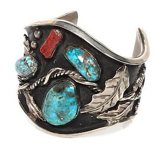 * A Monumental Navajo Silver, Turquoise and Coral Cuff Bracelet Length 6 1/2 x opening 3 x width 3 inches.