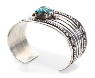 A Navajo Silver and Turquoise Cuff Bracelet, Ambrose Lincoln (1917-1989) Length 5 1/2 x opening 1 1/4 x width1 3/8 inches.