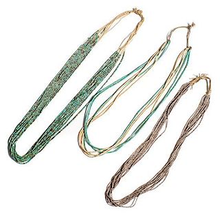 Three Fine Zuni Turquoise and Shell Heishi Necklaces Length of longest 28 inches.