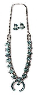 A Zuni Silver and Turquoise Petit Point Squash Blossom Necklace Length of necklace 24 inches.