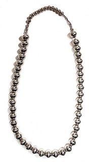 A Southwestern Style Silver Bead Necklace Length 20 inches with a 4 inch extender.