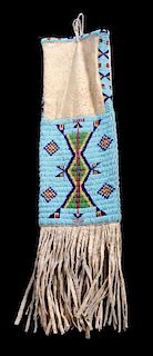 A Plains Beaded Hide Tobacco Bag Length overall 26 inches.