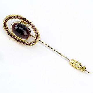 Vintage Garnet and 14 Karat Yellow Gold Stick Pin Set in the Center with an Oval  Cabochon Cut Garnet Measuring 13mm x 9mm. U