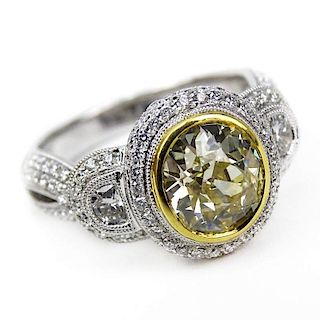 Approx. 1.80 Carat Oval Cushion Cut Fancy Yellow Diamond and 18 Karat White Gold Engagement Ring Accented throughout with App