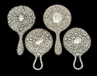 4 Sterling repousse hand mirrors