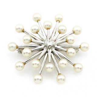 14k White gold, pearl and diamond brooch.