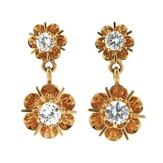 14k Yellow gold and diamond flower earrings.