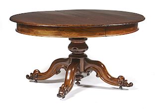 Victorian oval mahogany dining table on fancy scroll pedestal base