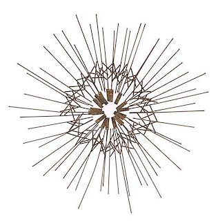 Attributed to Curtis Jere, USA, c.1980, a starburst metal wall sculpture