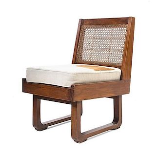French, EARLY 20TH CENTURY, a mahogany chair, with caned back and seat, finished with a modern pillow