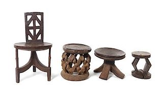African, FIRST HALF 20TH CENTURY, a carved wood chair, and three stools
