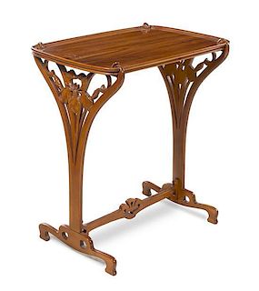 * French, FIRST HALF 20TH CENTURY, an Art Nouveau style carved mahogany occasional table