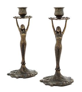 Tiffany Studios, EARLY 20TH CENTURY, a pair of bronze figural candlesticks