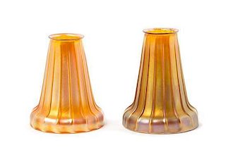 * Quezal, EARLY 20TH CENTURY, a pair of glass shades, each with ribbed decoration, together with a brass two-light fixture