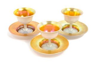 * Steuben, EARLY 20TH CENTURY, a set of eight Aurene sherberts and under plates, in gold iridescence