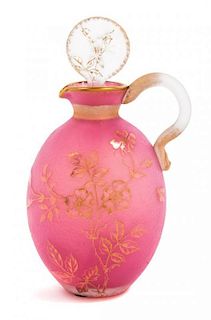 * Daum, EARLY 20TH CENTURY, a gilt decorated cameo glass cruet, of handled form with floral decoration and matching stopper