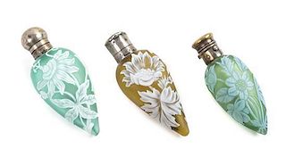 * English, LATE 19TH CENTURY, three silver mounted cameo glass perfume bottles, each of tapering form with floral decoration