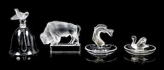 Lalique, a group of four molded and frosted glass articles, comprising a bell, two ring trays, and a figure of a buffalo