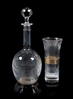 Baccarat, two cut glass table articles, comprising a decanter with a Christian Dior brass mounted vase