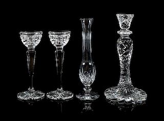 * Waterford, a group of three crystal candlesticks, comprising a pair and a single, together with a bud vase