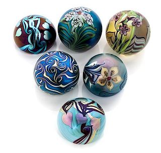 * Orient & Flume, CHICO, CA, a group of six iridescent glass paperweights, 1974-1981