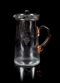 An Engraved Glass Covered Pitcher, Fenton Height 10 1/4 inches