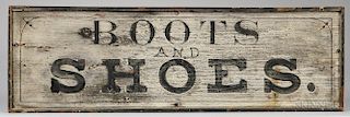 Painted "BOOTS AND SHOES." Sign