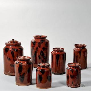 Seven Graduated Covered Cylindrical Redware Cannisters