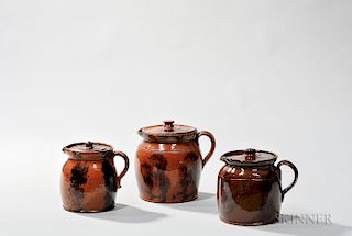 Three Small Redware Covered Pitchers