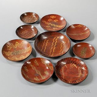 Nine Slip-decorated Redware Plates