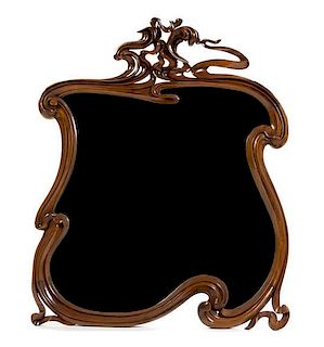 * A Continental Art Nouveau Walnut Mirror, Height 43 1/2 x width 33 1/2 inches.