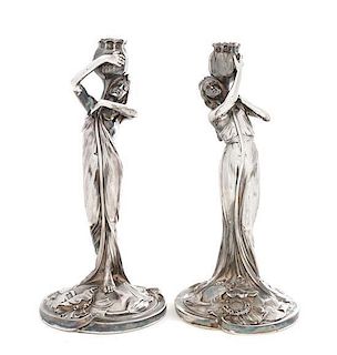 * A Pair of German Silver Figural Candlesticks, Height 10 3/4 inches.