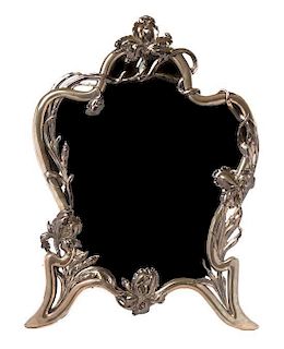 * An Austro-Hungarian Art Nouveau Silver Dressing Mirror, Height 24 1/2 x width 18 1/4 inches.