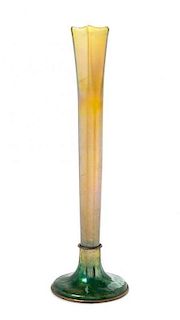 * A Tiffany Studios Gold Favrile Glass and Enameled Stick Vase, Height 13 inches.