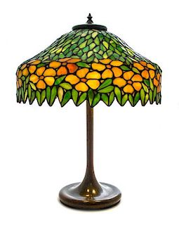 * An American Leaded Glass Lamp, Diameter of shade 18 x height overall 24 inches.
