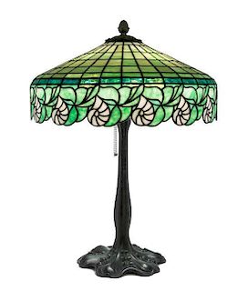 * An American Leaded Glass and Cast Metal Table Lamp, Diameter of shade 18 1/2 x height overall 23 1/4 inches.