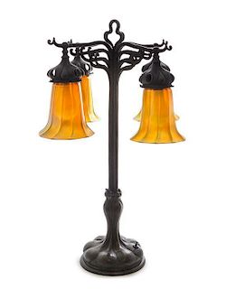 * An American Art Nouveau Cast Metal and Quezal Glass Table Lamp, Height overall 25 x height of shades 5 1/4 inches.