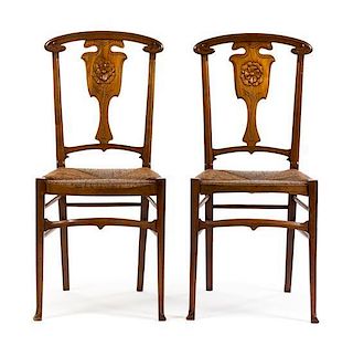 * A Pair of Art Nouveau Oak Side Chairs, Height 36 inches.