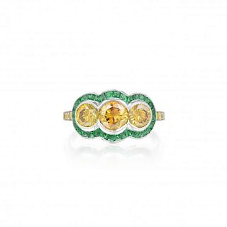 A Yellow Diamond and Emerald Ring